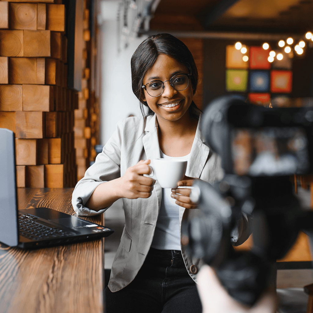 Women with coffee talking about experience at coffee shop